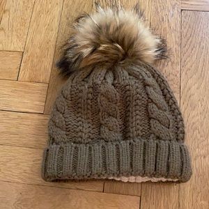 Knit hat with fur ball